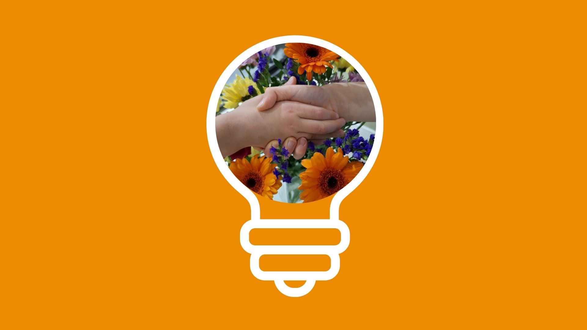 Light bulb icon on orange background showing two people holding hands in front of orange flowers